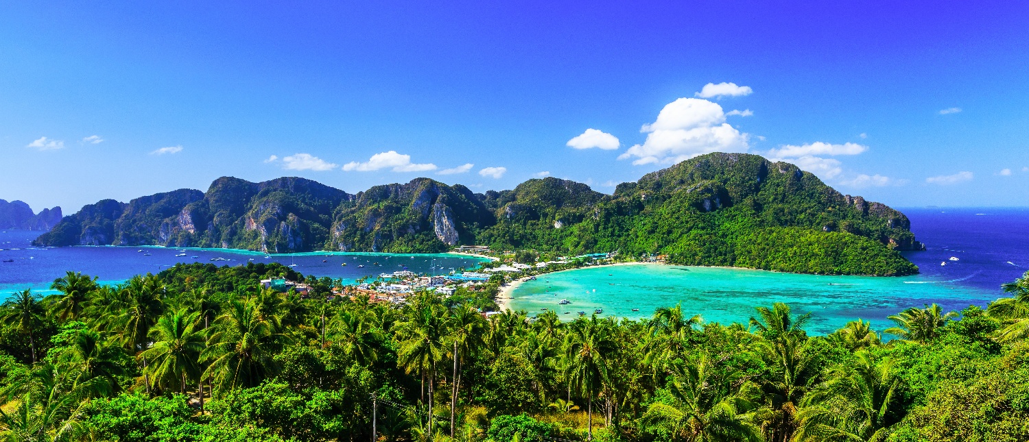 Panoramic view of lush green mountains and turquoise sea at Koh Phi Don viewpoint