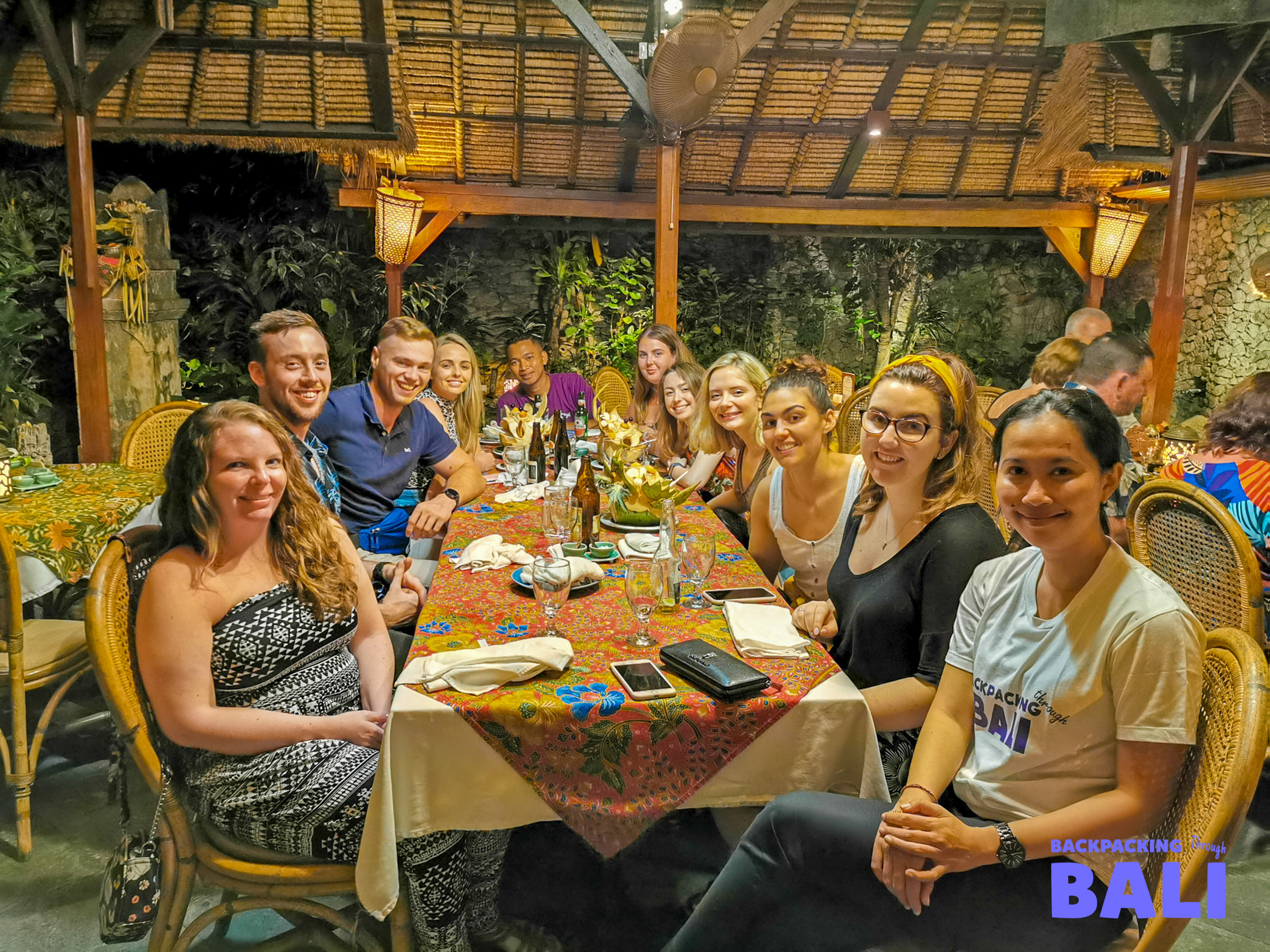 Backpacking group enjoying lunch at a local restaurant in Bali
