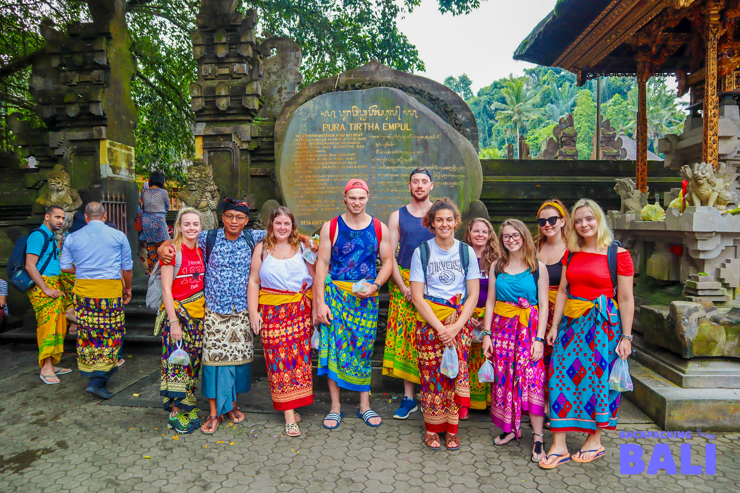 Backpacking group posing again at the entrance to Pura Tirta Empul