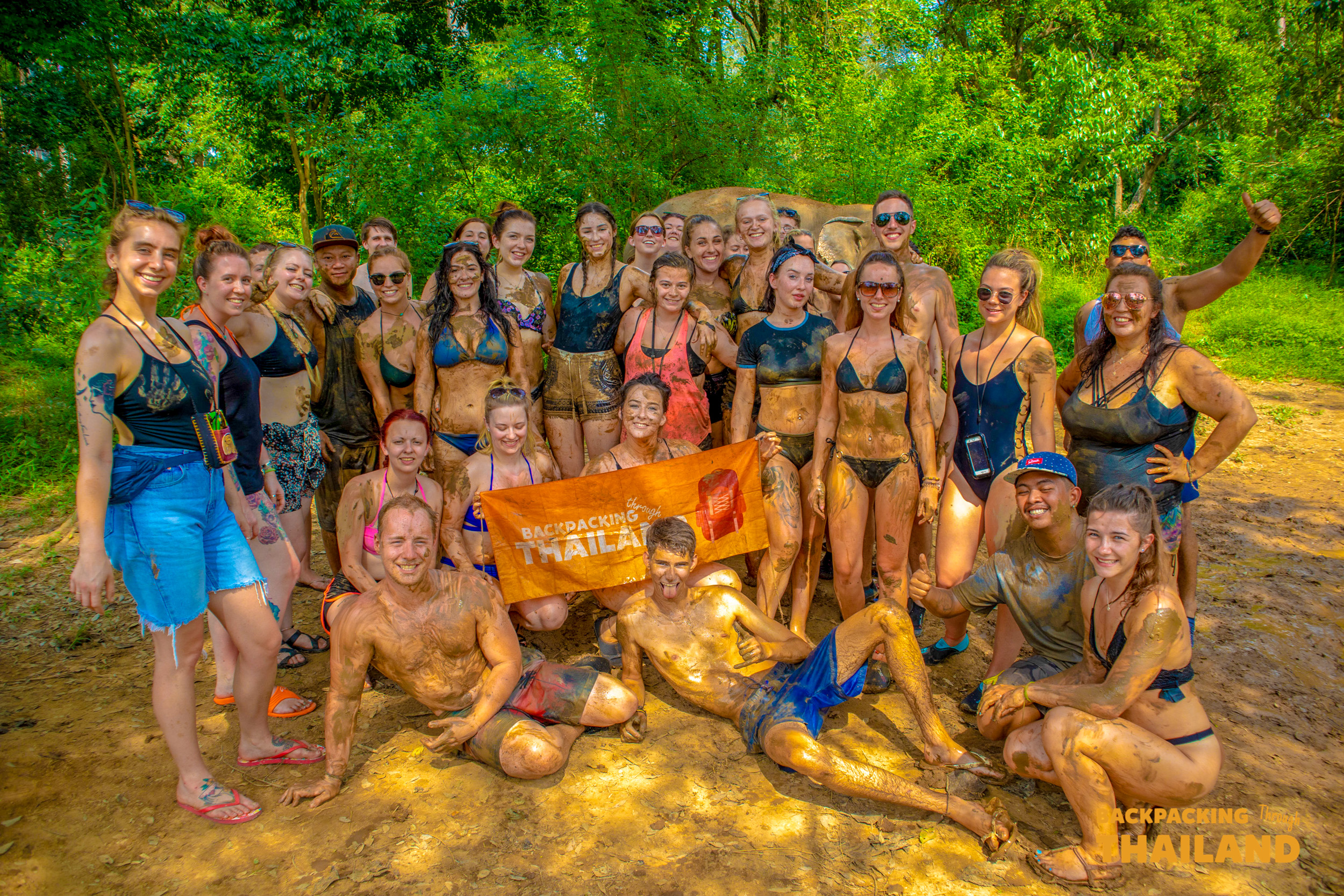 Backpacking group posing together for a photo at the elephant sanctuary