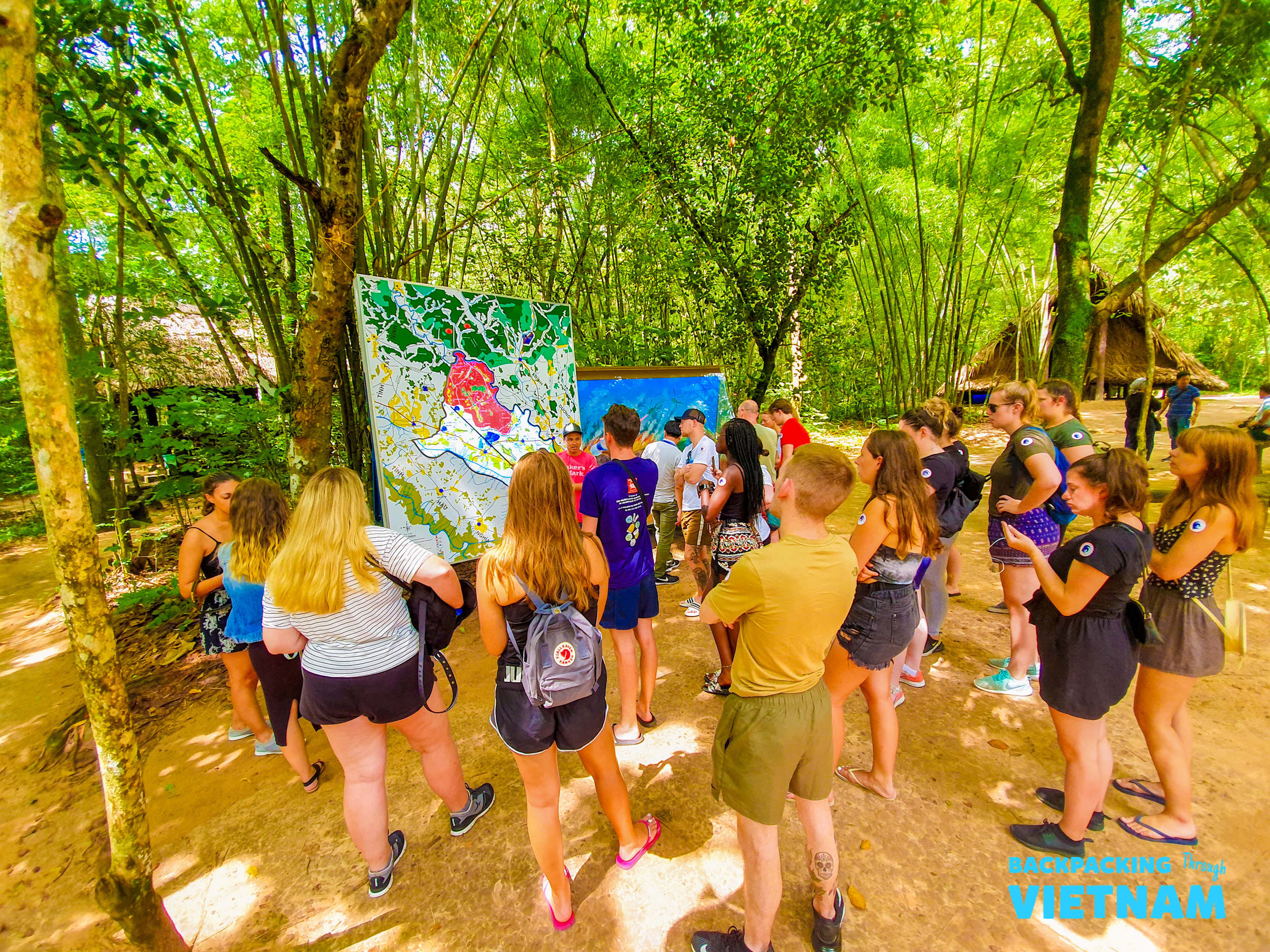 Backpacking group at entrance of Cu Chi Tunnels