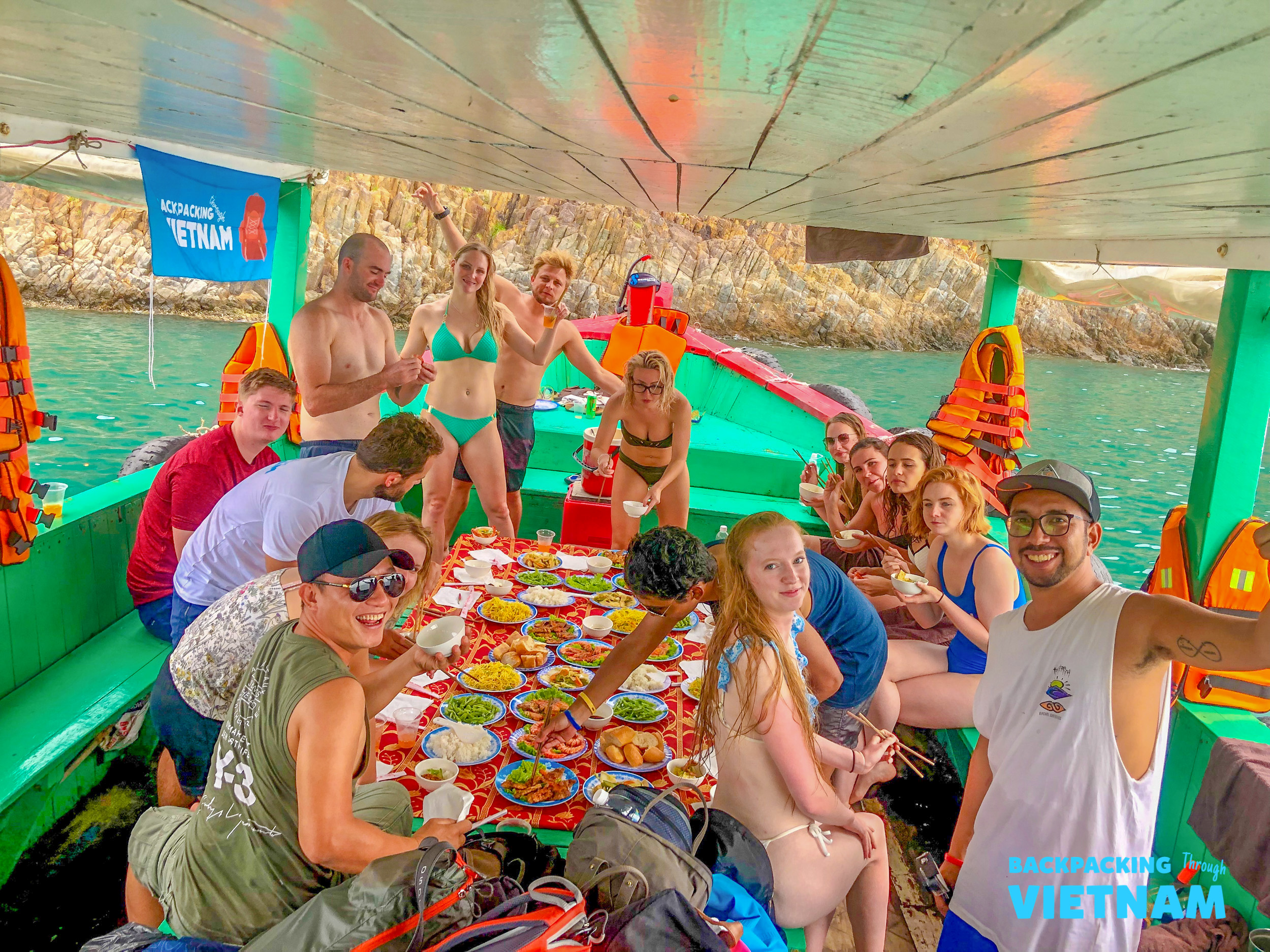 Friends dancing at colourful boat party in Nha Trang
