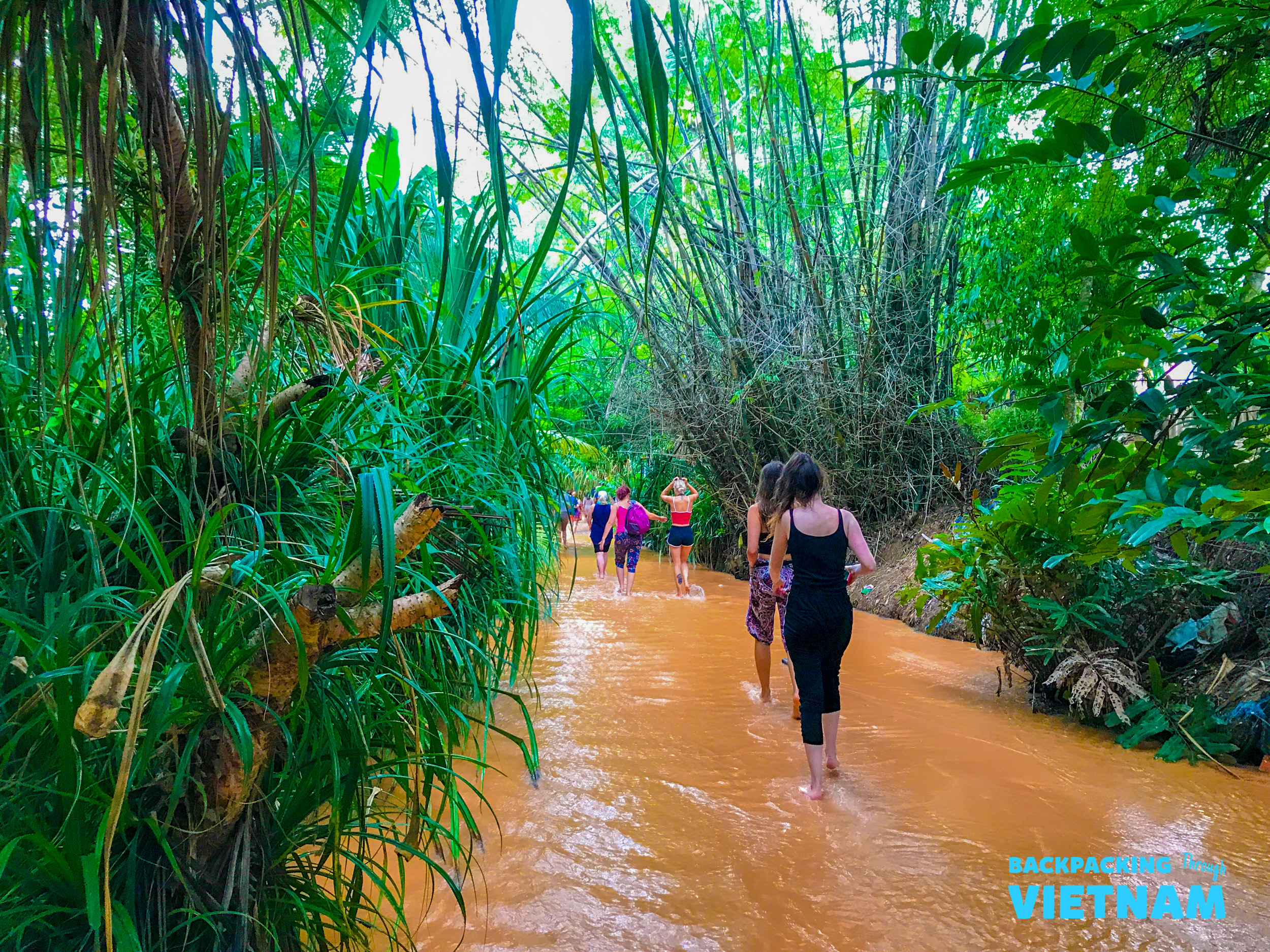 Group walking through Fairy Stream canyon in Mui Ne