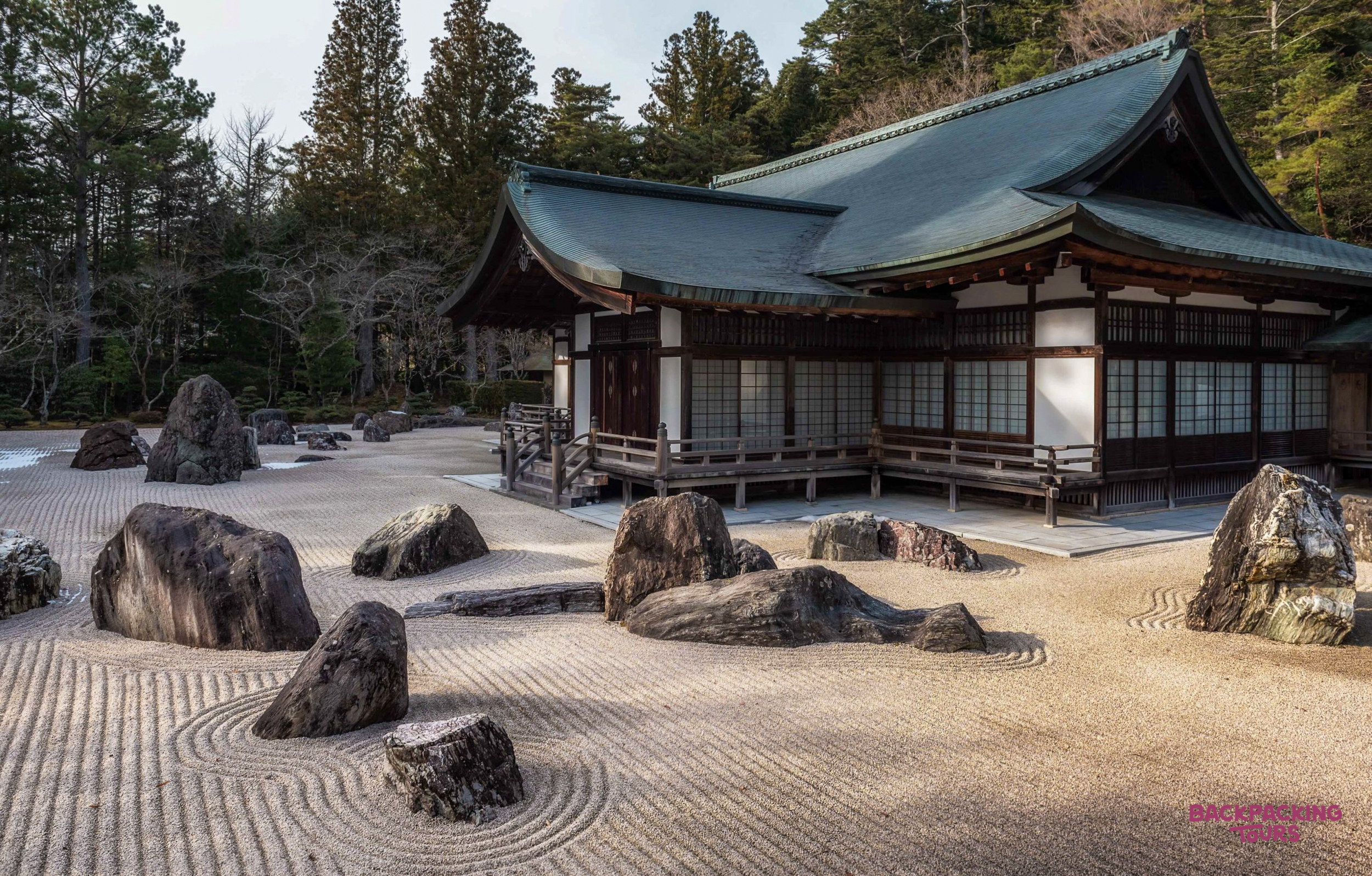 The tranquil dry landscape garden with raked gravel and rocks at a traditional temple in Koyasan.