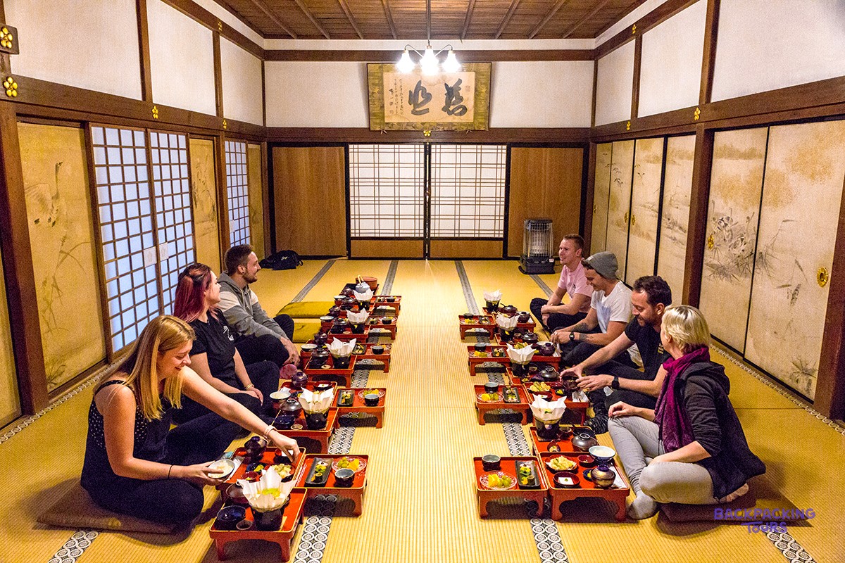 Travellers sharing the monks' traditional vegetarian dinner at a Koyasan temple