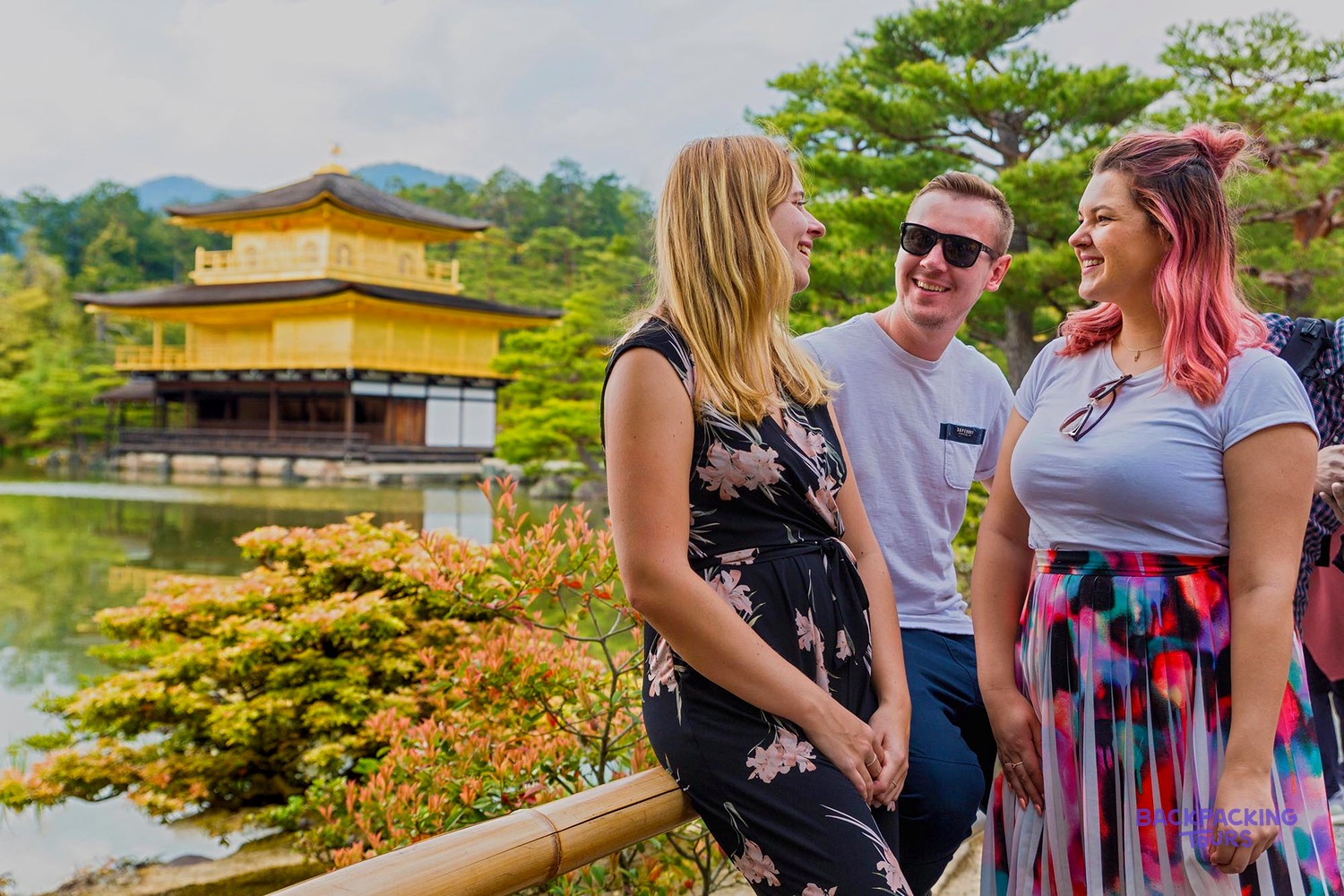 Group of travellers in front of the Golden Pavilion in Kyoto