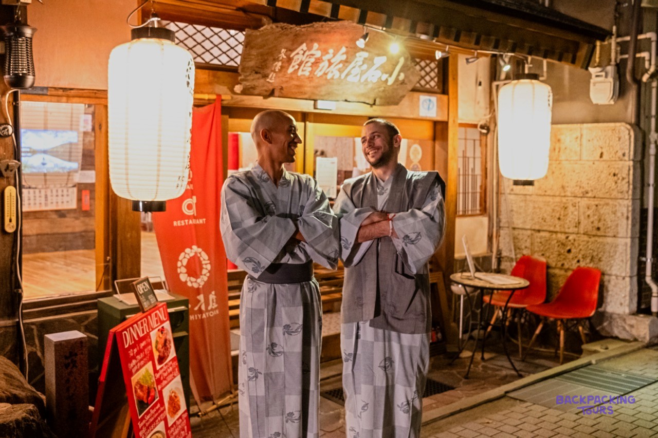 Travellers in yukata robes at a traditional Japanese inn in Nagano