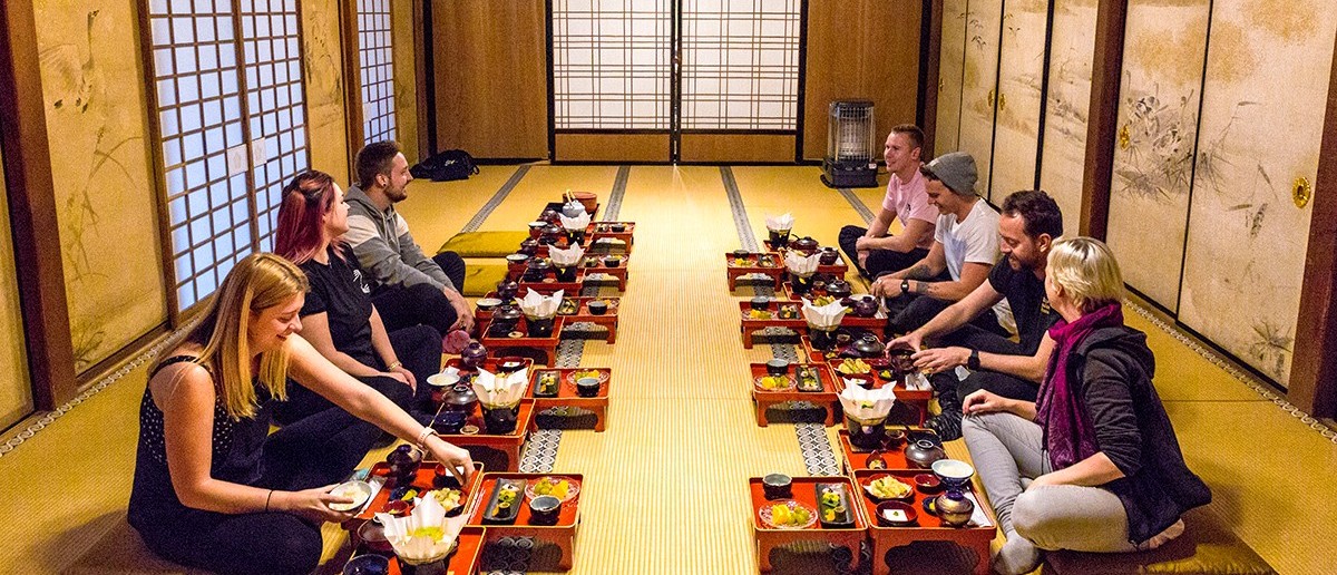 Travellers sharing the monks' traditional vegetarian dinner at a Koyasan temple