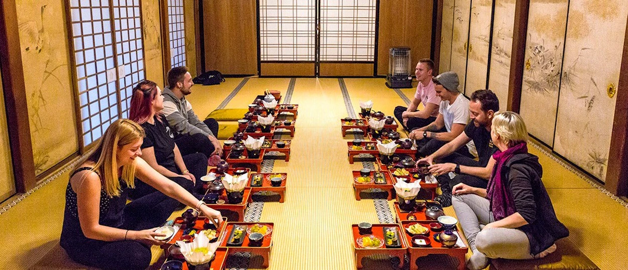 Travellers sharing the monks' traditional vegetarian dinner at a Koyasan temple