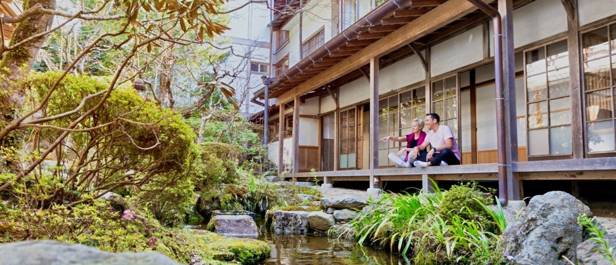 Wooden temple buildings and mossy gardens in Koyasan