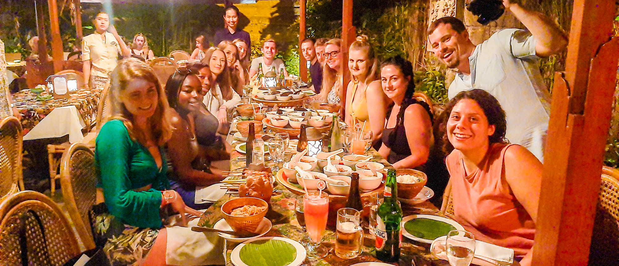 Backpacking group enjoying Balinese welcome dinner