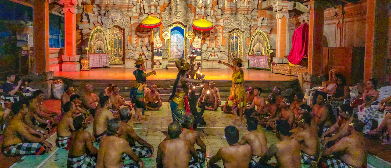 Balinese dancers perform a traditional Kecak fire dance for an audience at a temple in Ubud.