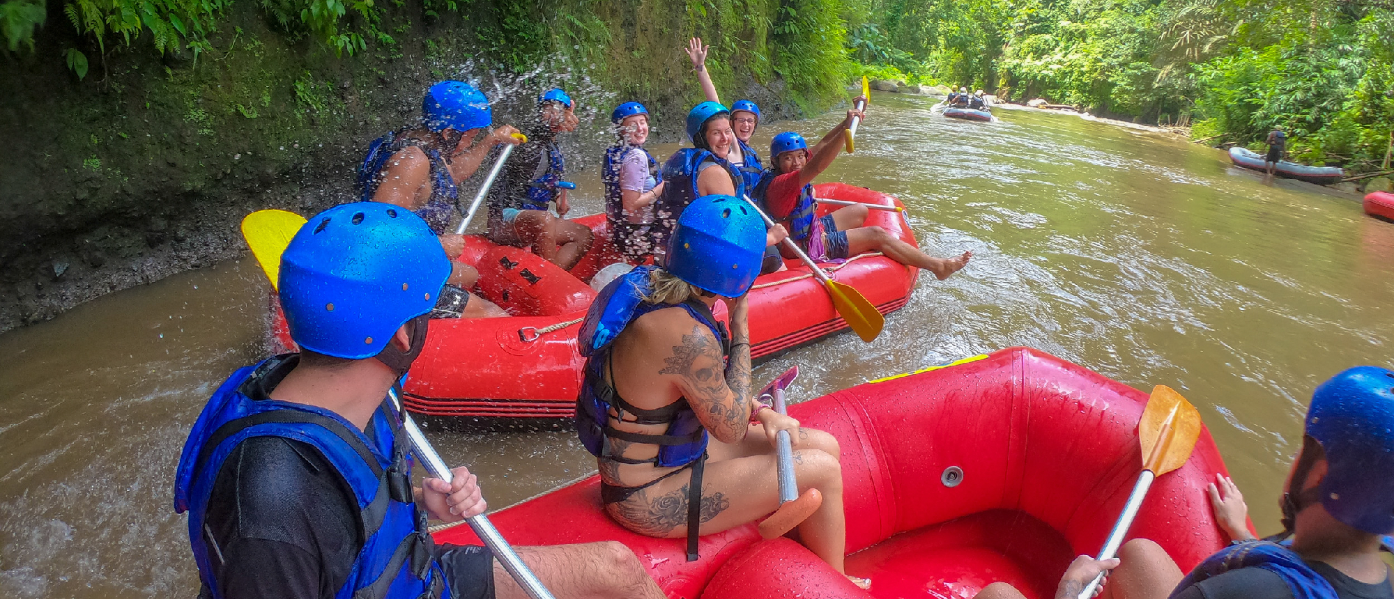 Backpacking group preparing for rafting adventure near Ubud
