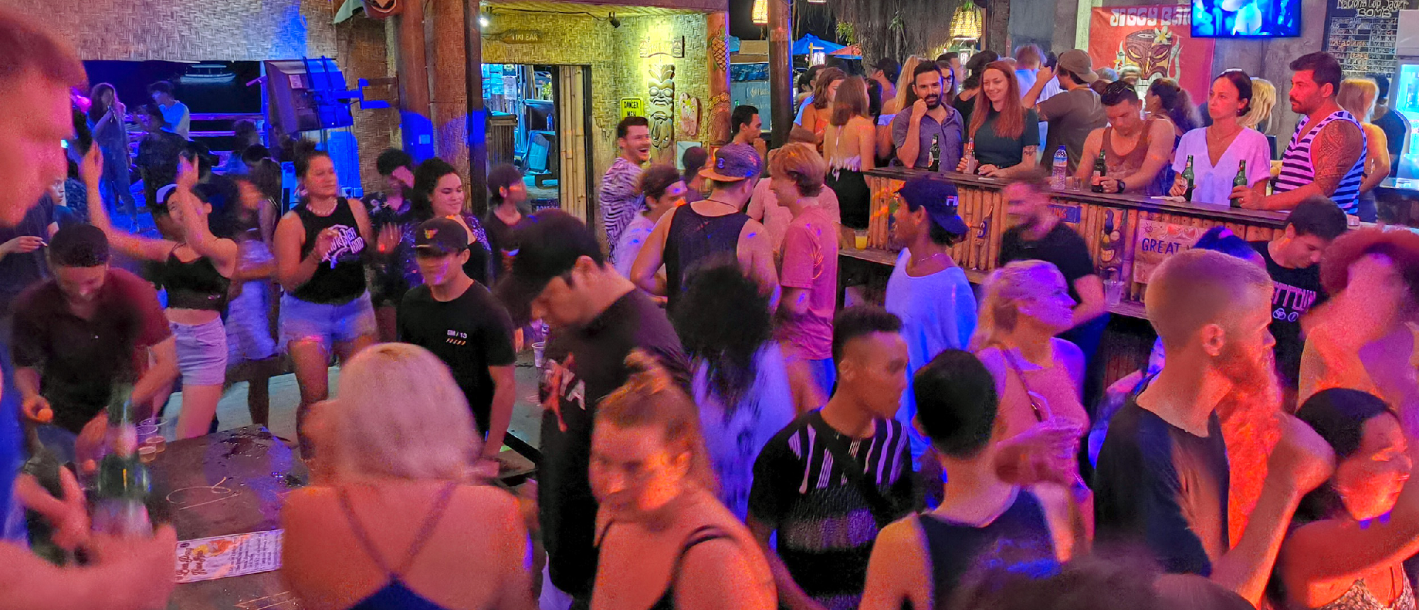 Backpacking group partying at a beach bar on Gili Trawangan