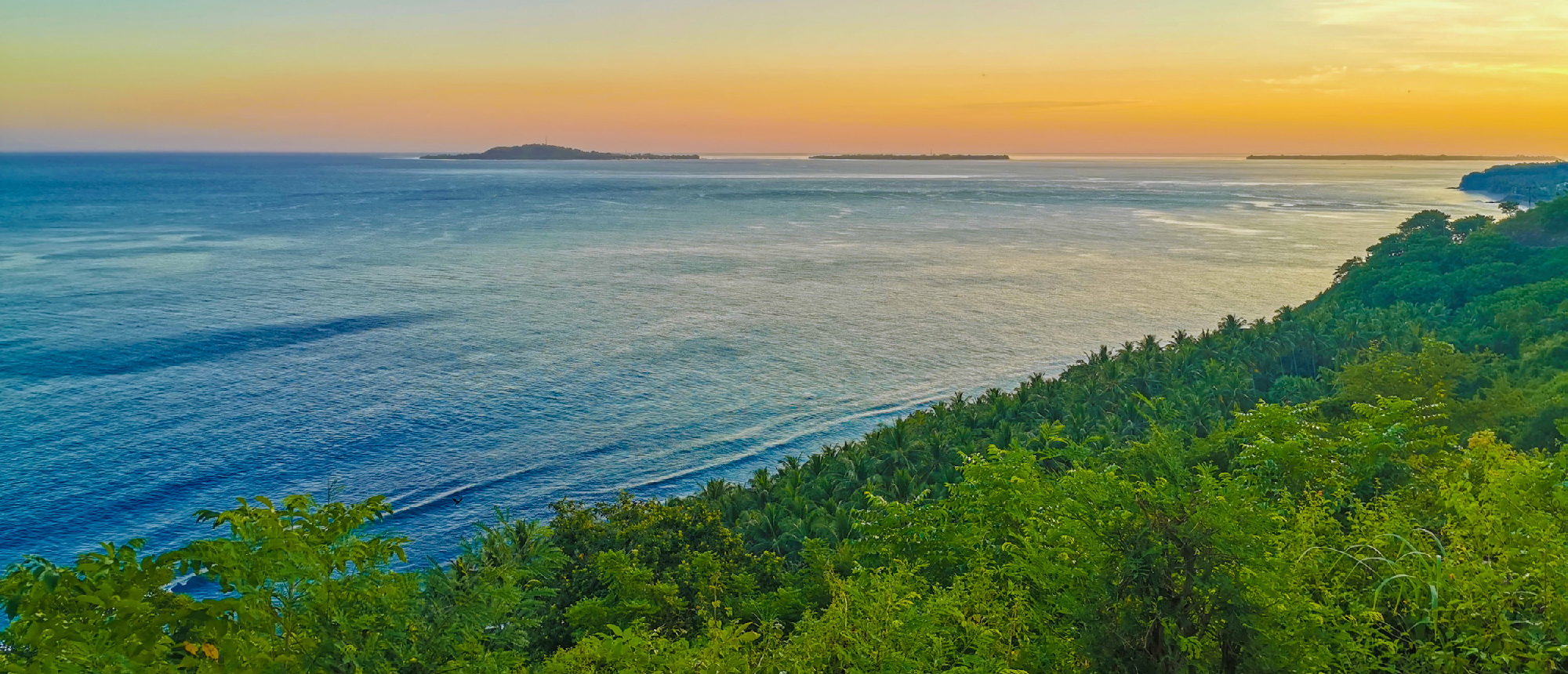 Scenic coastline and hills at sunset on Gili Trawangan