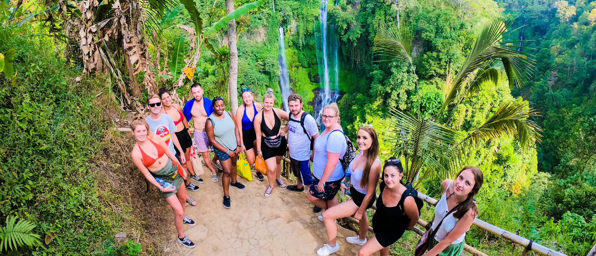 Backpacking group resting on a jungle path