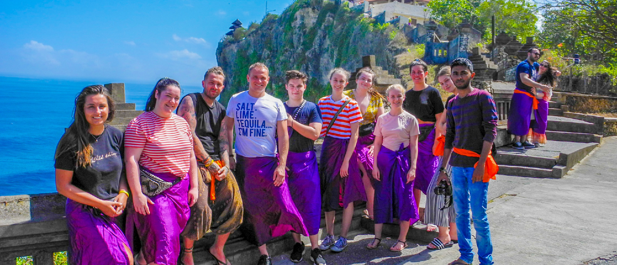 Travelers posing on coastal path in Bali