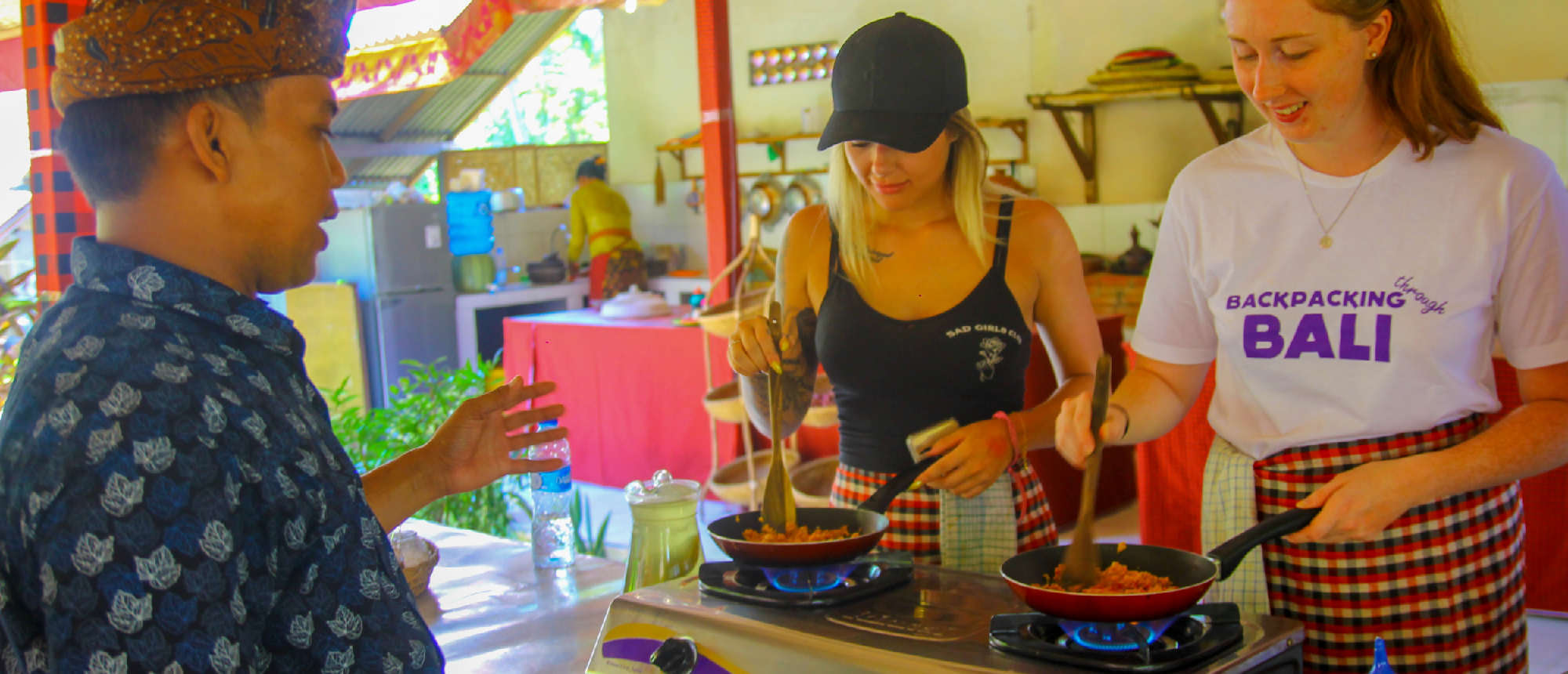 Backpacking group participating in a Balinese cooking class in Ubud