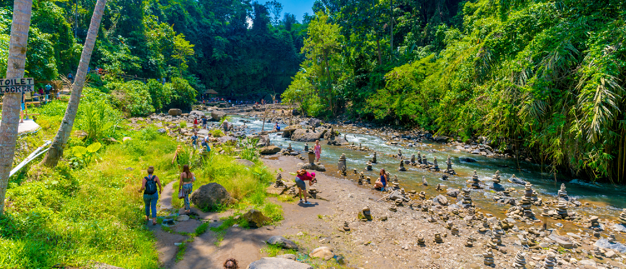 Travelers relaxing at Tegenungan Waterfall