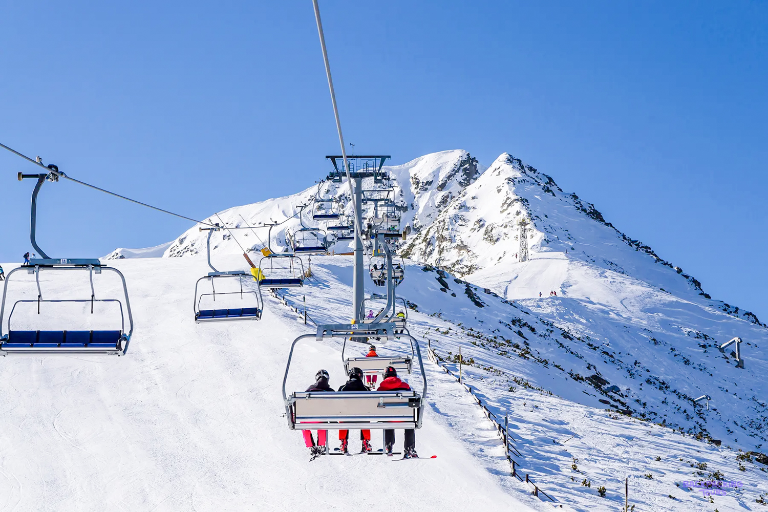 Ski lift climbing over Bansko's slopes on Day 4