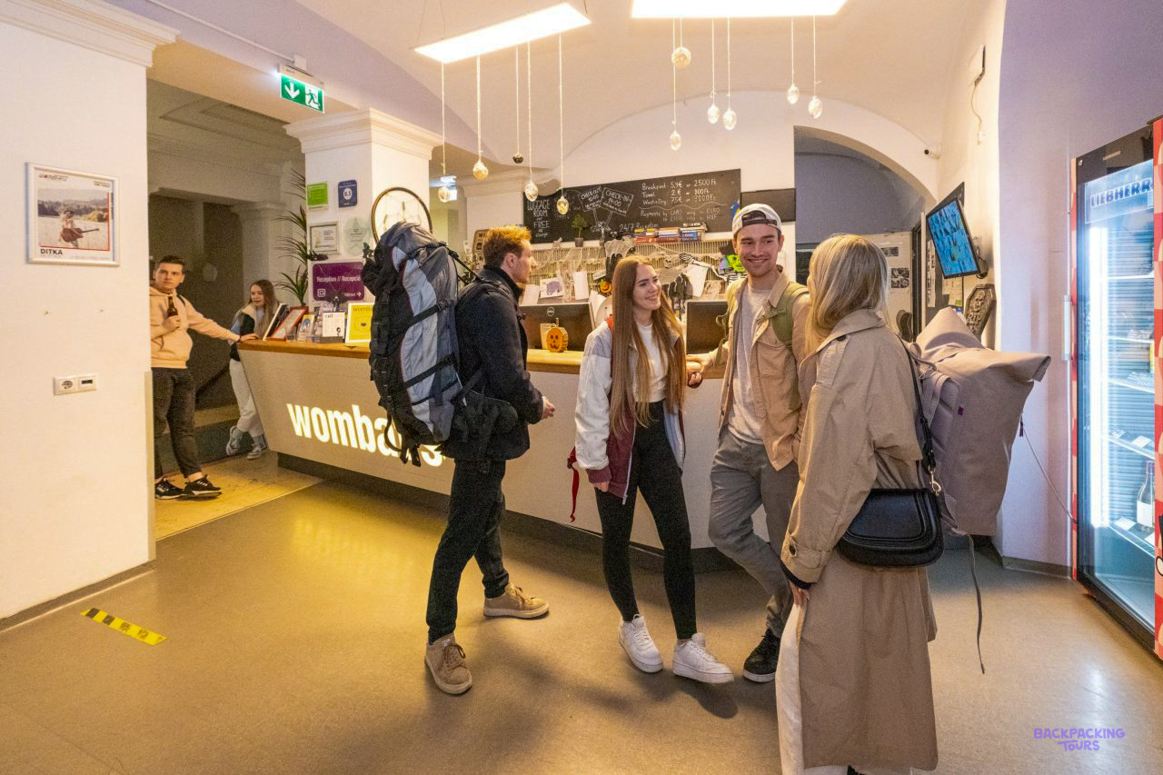 Travellers checking in at the reception of the Budapest hostel