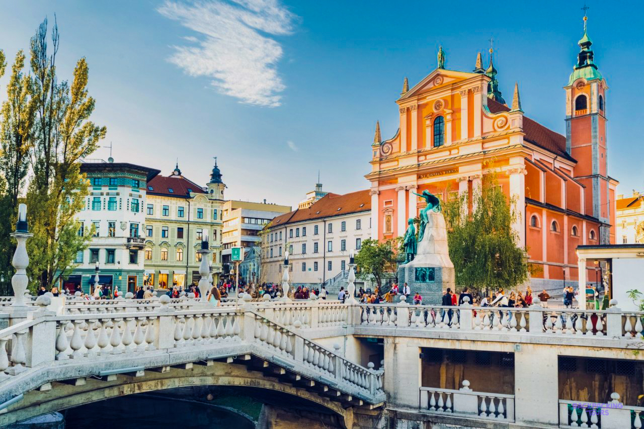 The pink Franciscan Church and the Triple Bridge in the centre of Ljubljana