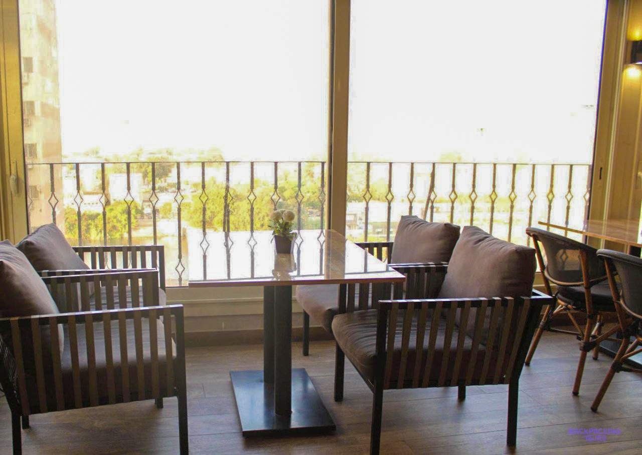 Armchairs by a big window in the lounge of the hotel in Cairo