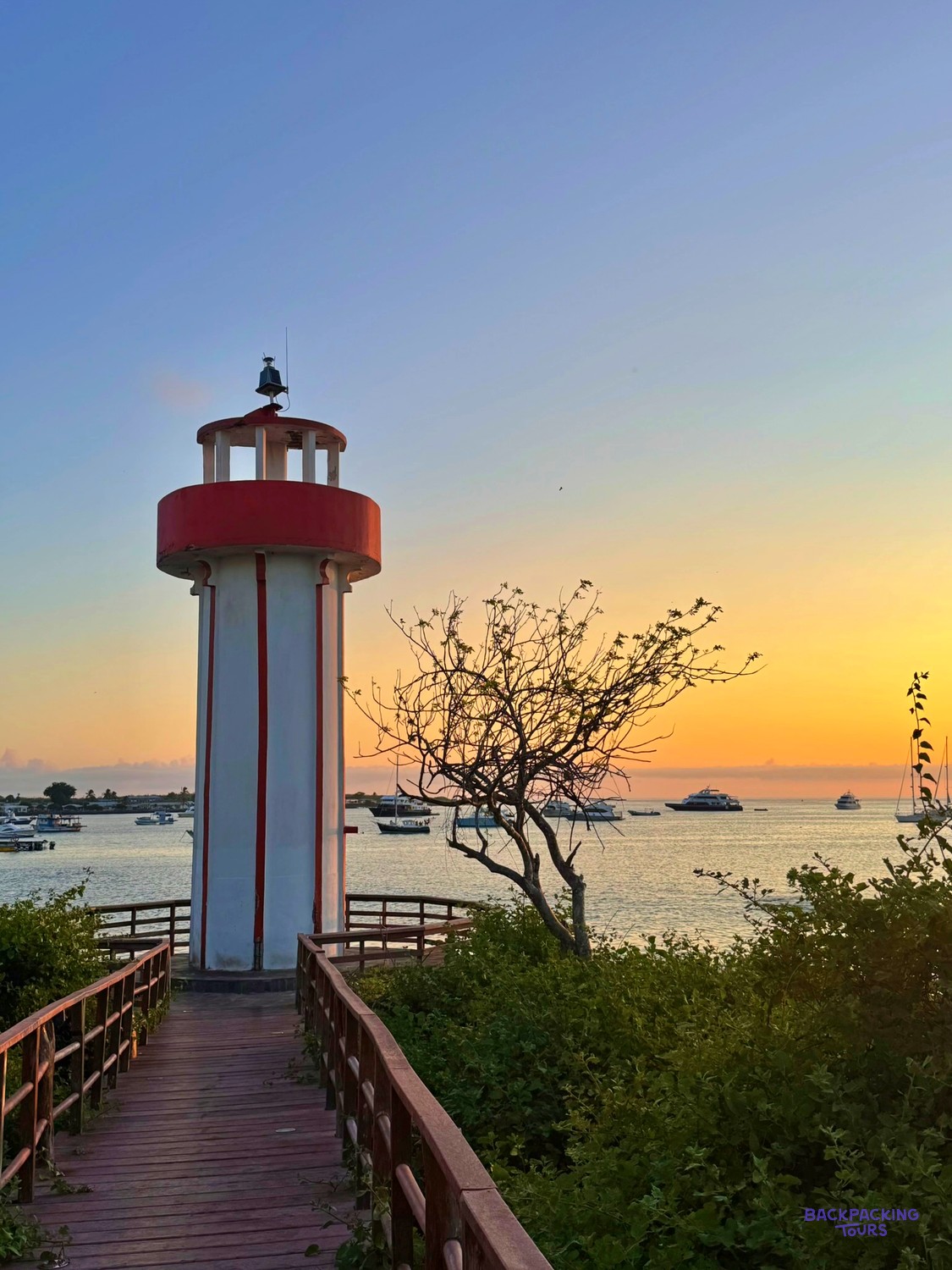 Harbour lighthouse at sunset in the Galapagos
