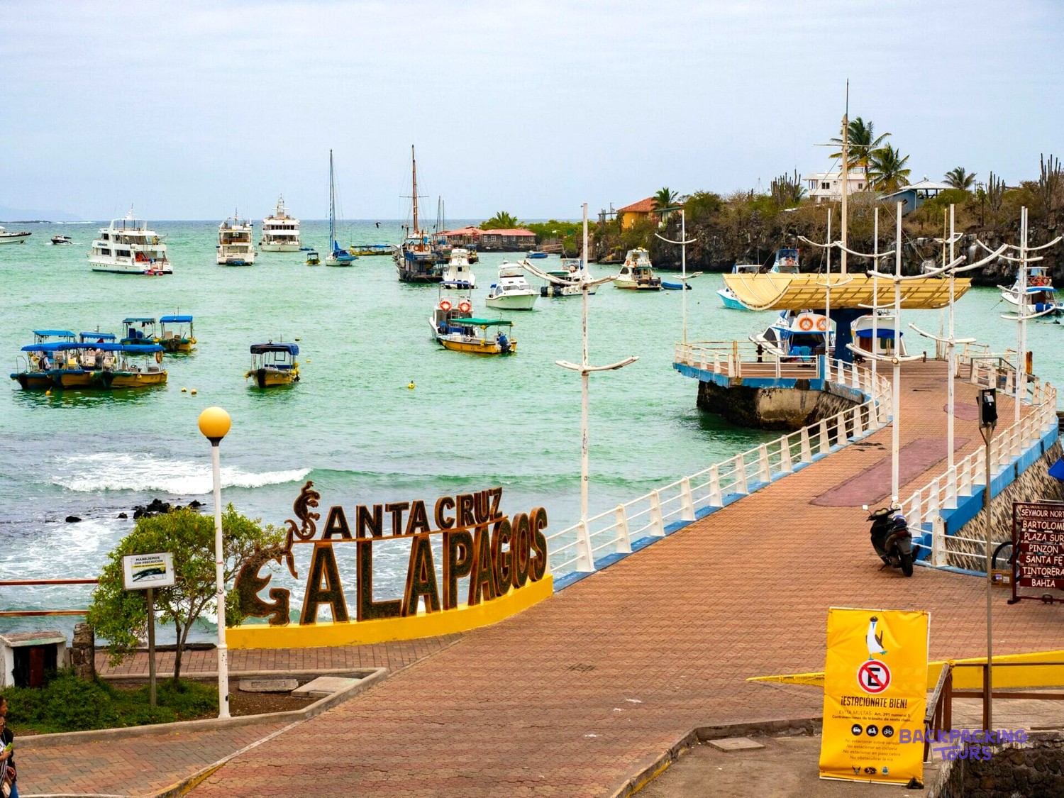 Santa Cruz Galapagos sign on the pier at Puerto Ayora