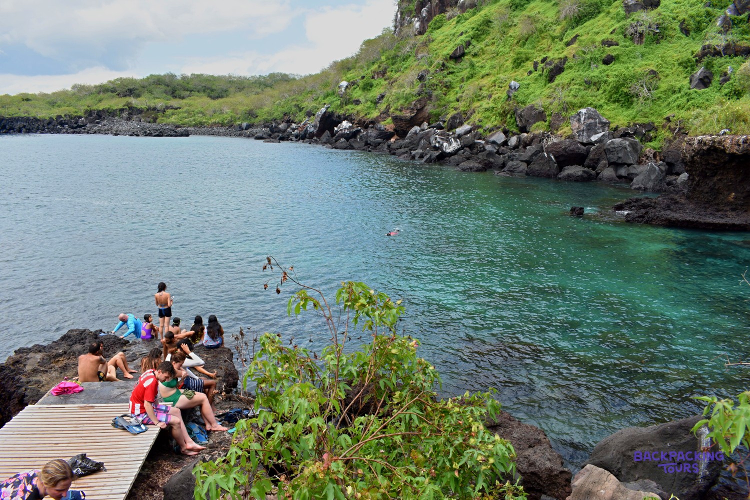 Swimmers in the sheltered lagoon at Tijeretas