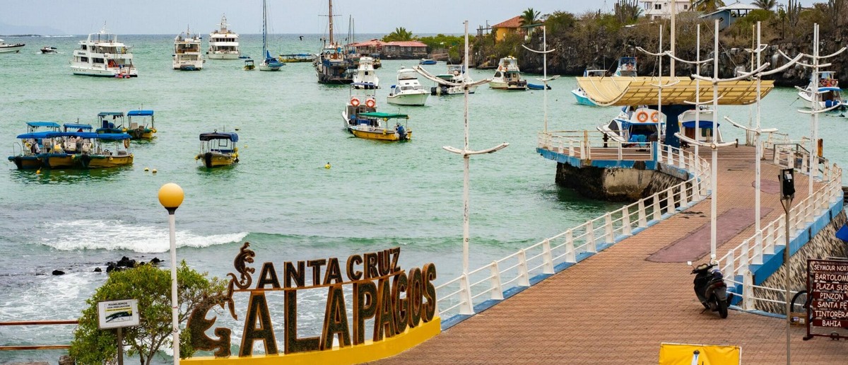 Santa Cruz Galapagos sign on the pier at Puerto Ayora