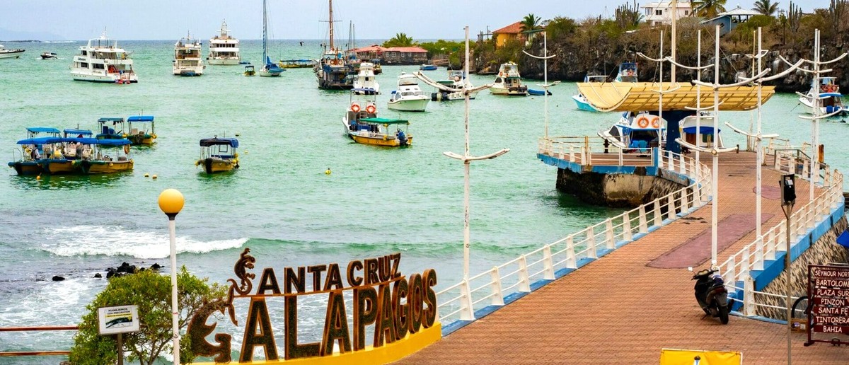 Santa Cruz Galapagos sign on the pier at Puerto Ayora
