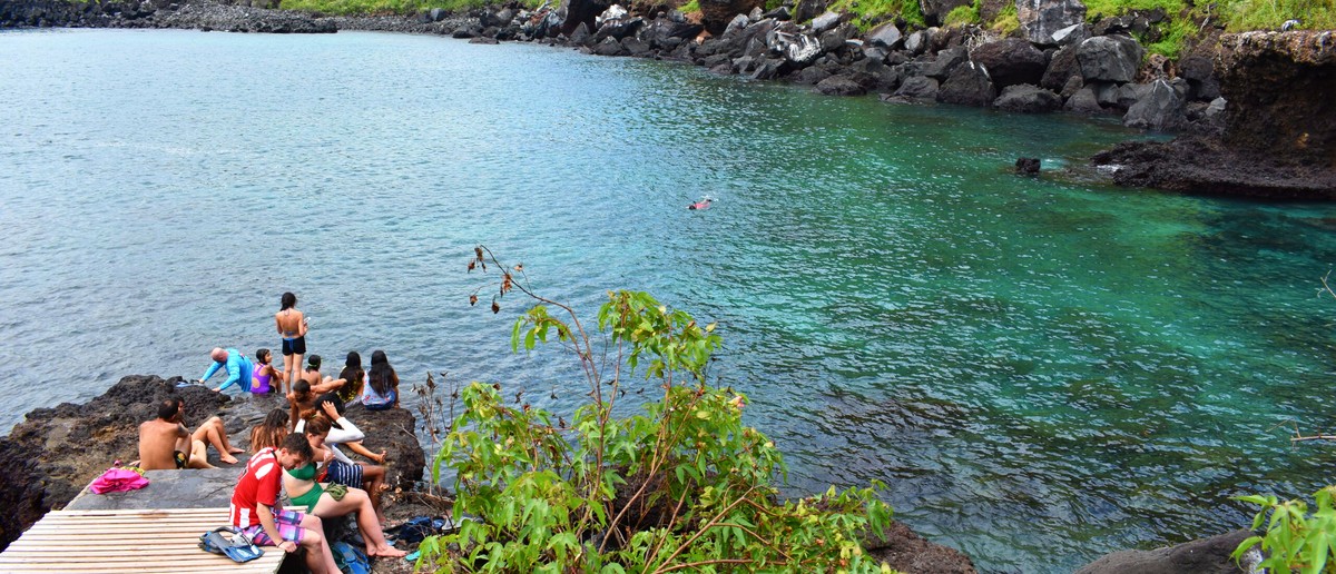 Swimmers in the sheltered lagoon at Tijeretas