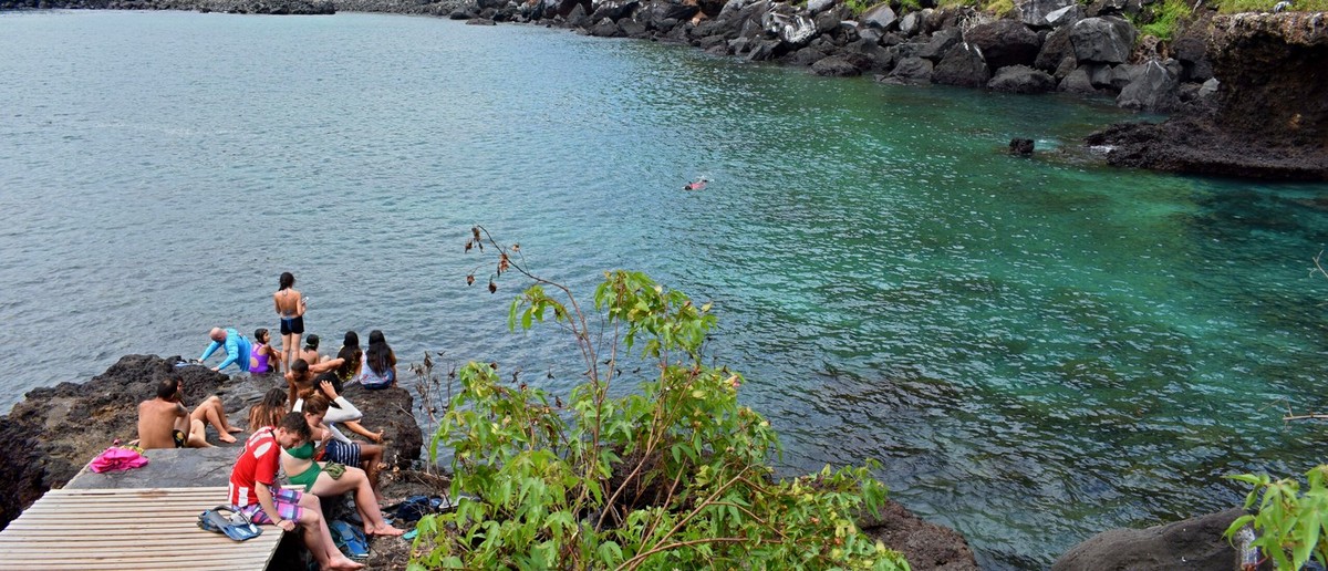 Swimmers in the sheltered lagoon at Tijeretas