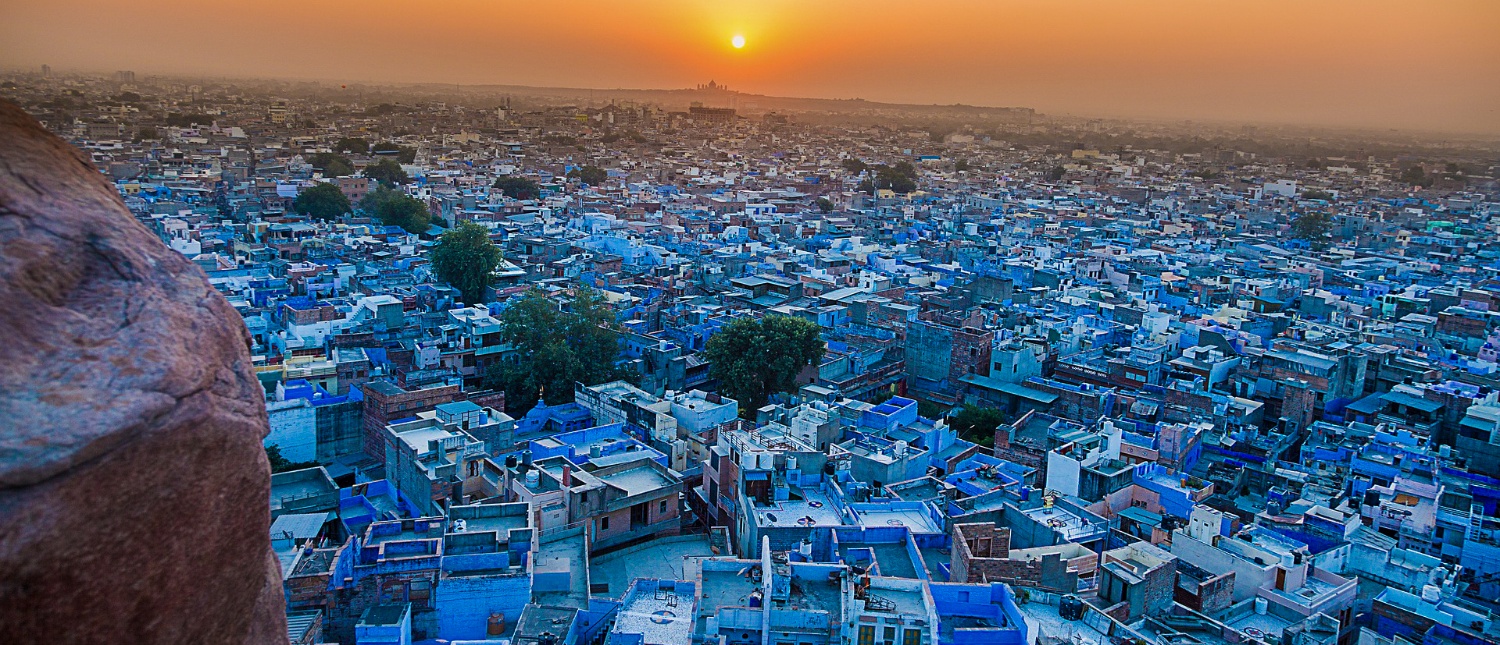 The enchanting blue city of Jodhpur at sunset, with countless blue buildings stretching to the horizon.