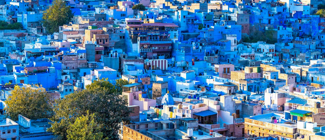The vibrant blue city of Jodhpur, India, with a dense maze of blue-painted buildings.