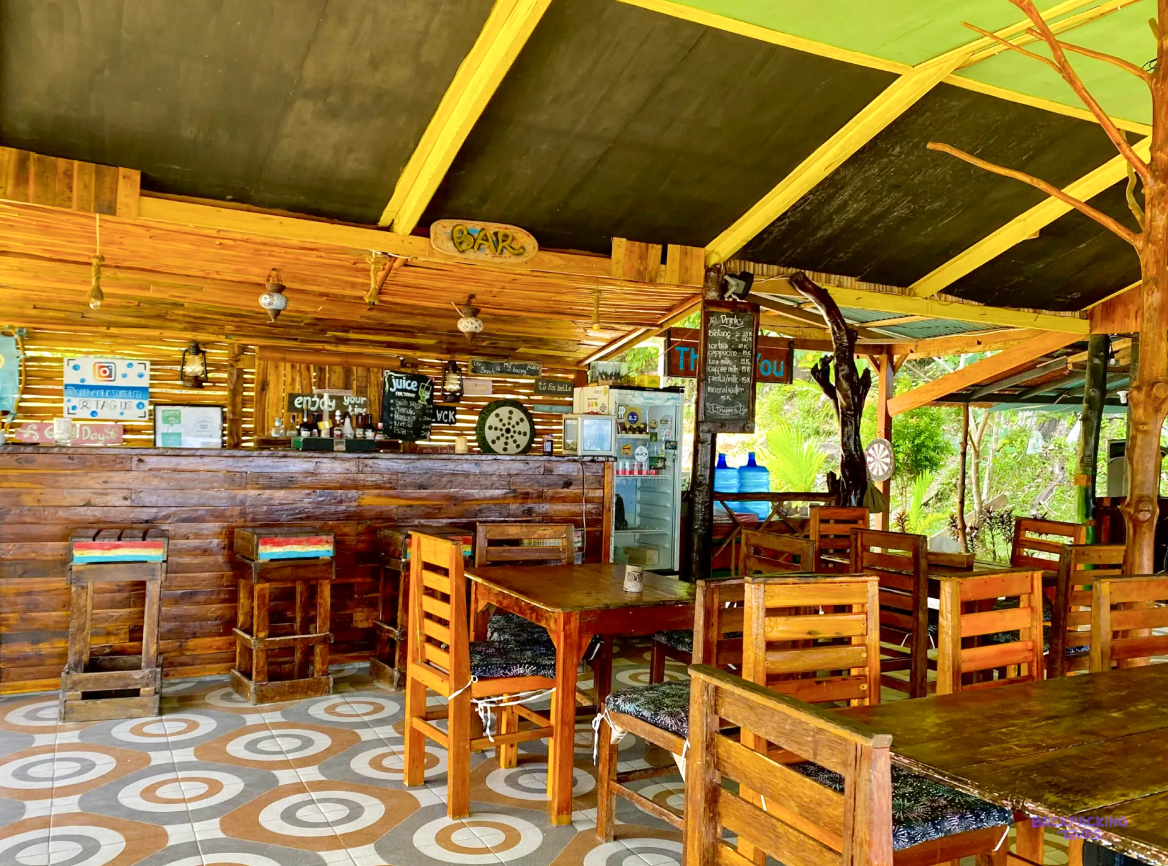 The wooden bar and dining room of the beach huts at Sungai Pinang