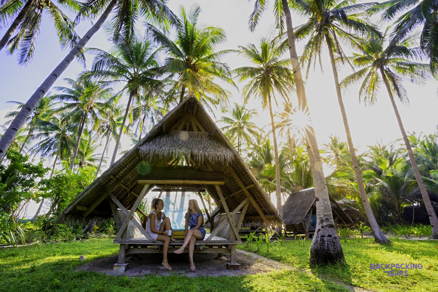Simple traditional beach huts on a remote island used on the boat expedition.