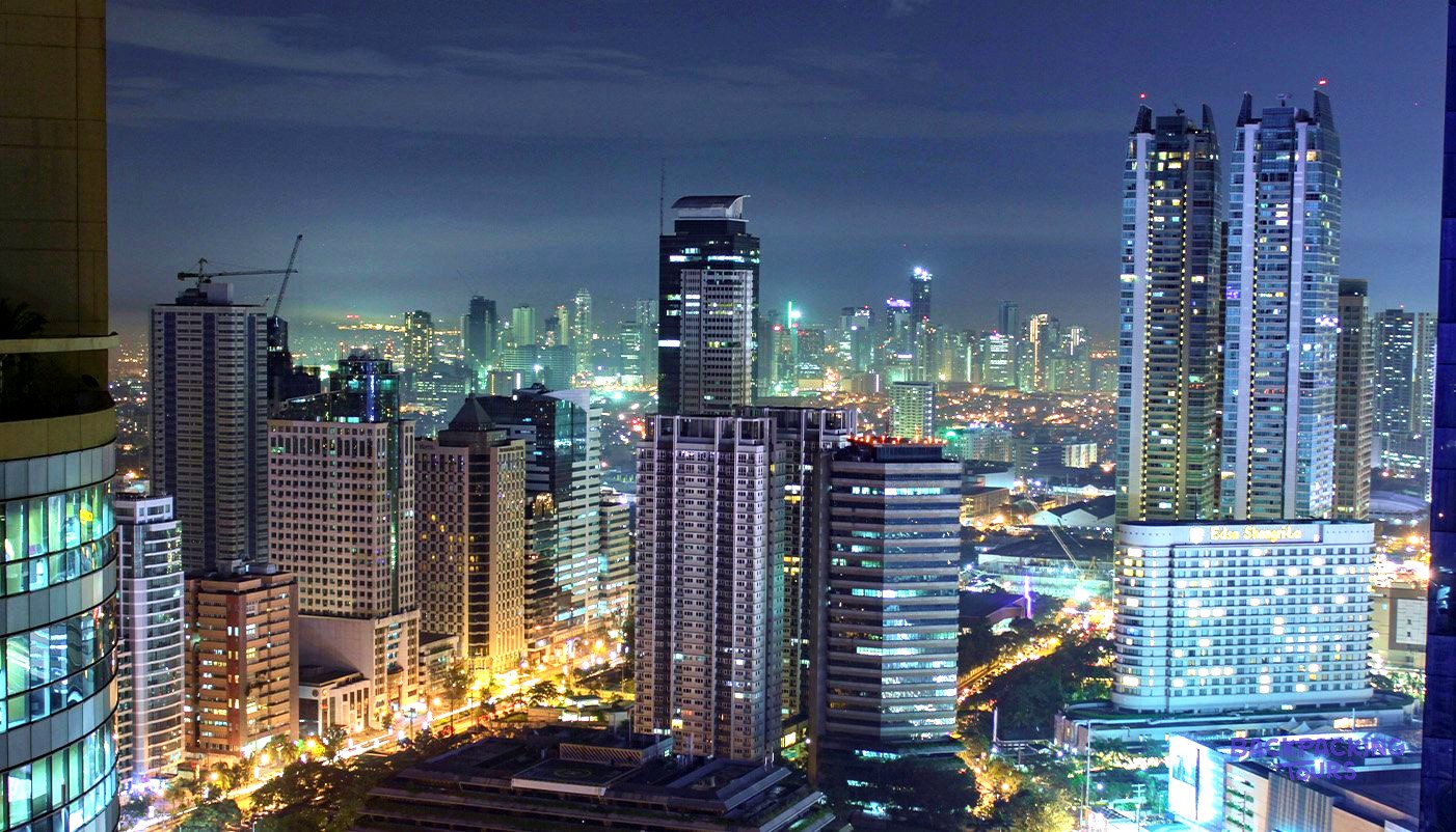 The Manila skyline at sunset on the last day of the Philippines tour.