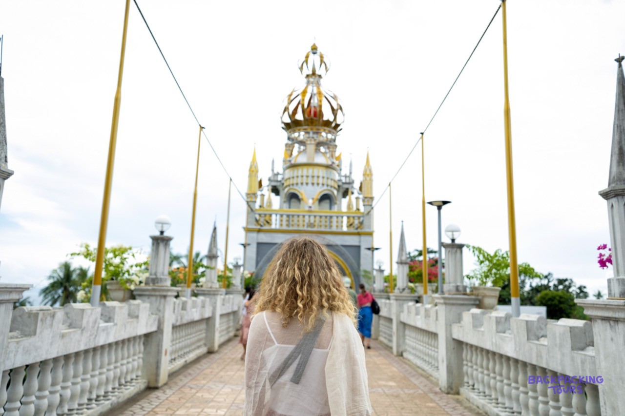 The castle-like white towers of Simala Shrine rising above the hills of Cebu.