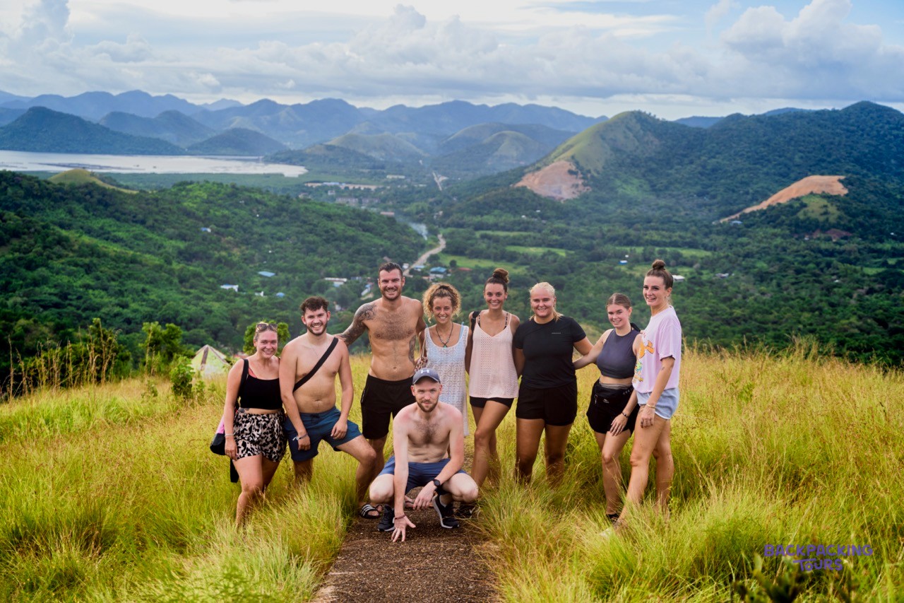 A group of backpackers celebrating at the Mount Tapyas viewpoint above Coron.
