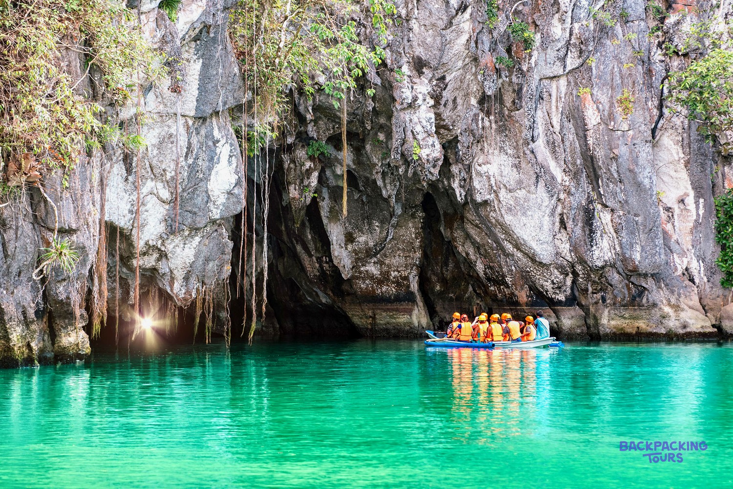 A boat entering the mouth of the Palawan Underground River cave system.