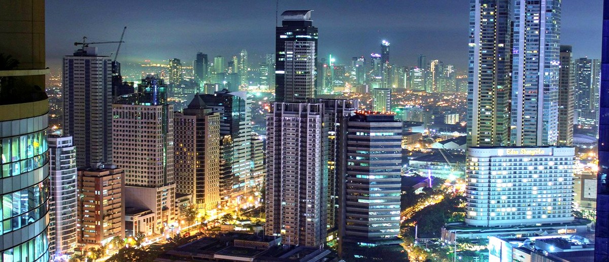 The Manila skyline at sunset on the last day of the Philippines tour.
