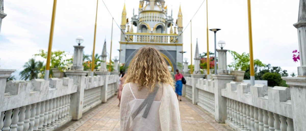 The castle-like white towers of Simala Shrine rising above the hills of Cebu.