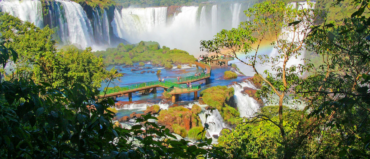Rainbows rising from the mist above Iguacu Falls