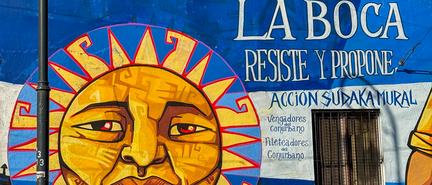 A vibrant sun mural on a wall in the La Boca neighbourhood of Buenos Aires