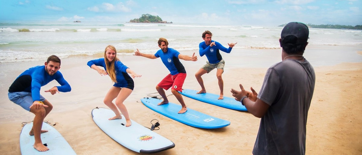 Learning to surf at Weligama Beach