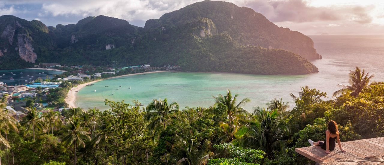 Sunrise view of the Phi Phi viewpoint overlooking lush islands and turquoise bay during the backpacking tour