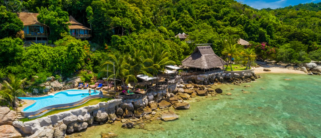 Beautiful resort with a unique pool, sandy beach, and clear waters on Koh Tao.
