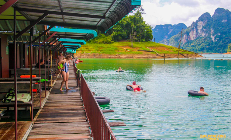 Guests relax in inner tubes by floating bungalows on Cheow Lan Lake, Khao Sok National Park.